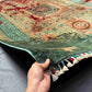 Front view of 6x8 handmade wool & silk Mamluk rug held in hands