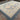 Blue and beige handmade rug laid flat in spacious room