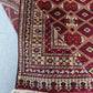 Folded view showing softness and thickness of handmade wool silk rug