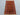 Styled top view of handmade wool rug in a rustic room setting