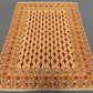 Handmade Afghan rug styled on hardwood floor for home interior