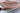 Heriz 7x11 red blue wool area rug with tribal geometric rug design