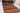 Landscape 7x10 red wool area rug with tribal geometric rug design