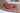 Heriz 7x11 red blue wool area rug with tribal geometric rug design