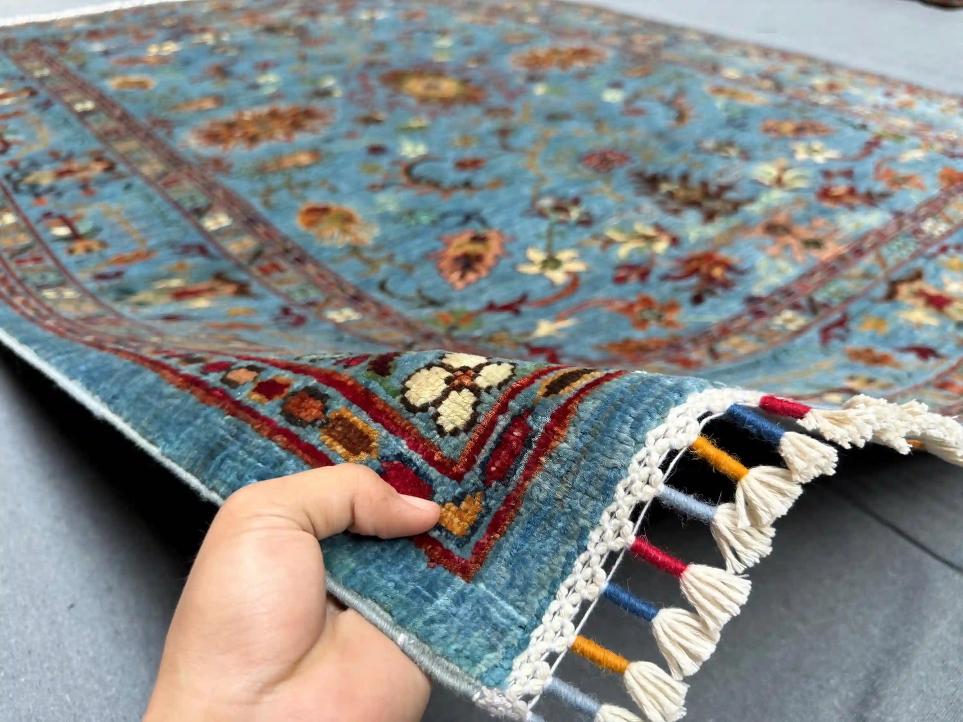 Handmade 5x7 Sultani wool rug in hands – Persian style rug texture