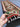 Handmade 2.1x6.6 ft Kilim runner rug shown in hands – red & green tribal diamond pattern