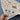 Handmade ivory Sultani runner rug held in hands showcasing fine texture
