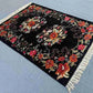Karabakh vintage floral rug on floor in bohemian-styled home interior