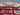 Folded view highlighting wool silk material of red tribal Kazakh carpet