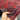 In hands view of handmade Khal Mohammadi rug in red and navy wool