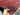 In hands view of handmade Khal Mohammadi rug in red and navy wool