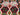  Close-up of red and green geometric pattern on tribal Kilim rug