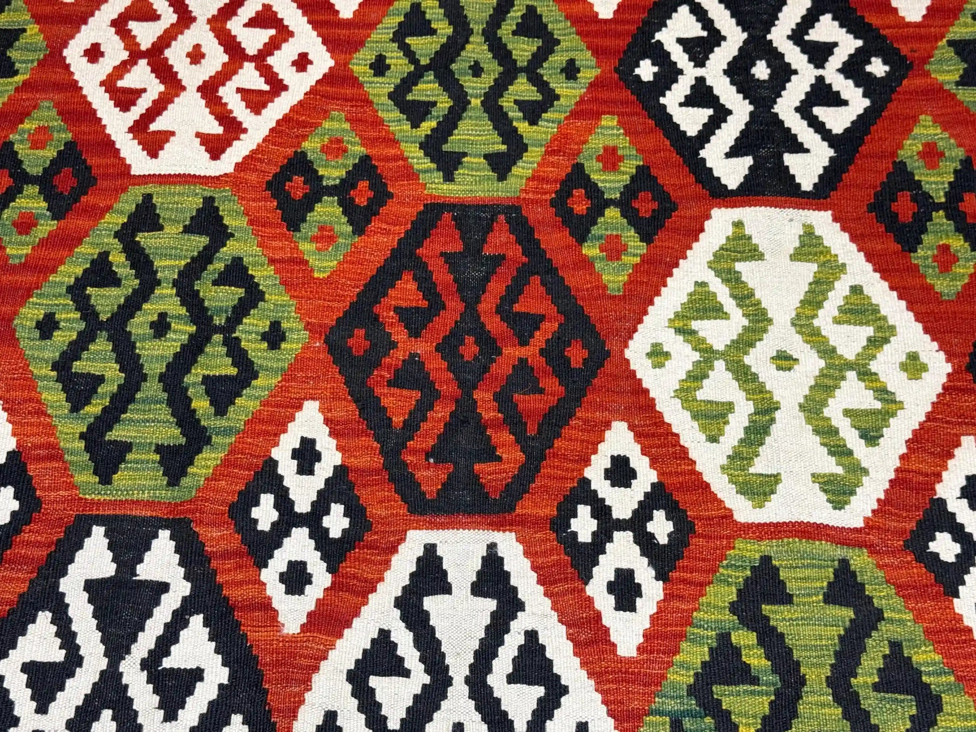 Close-up of tribal hexagon pattern on Turkish Kilim wool rug