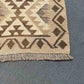 Corner finish of handmade wool flatweave rug