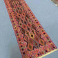 Long hallway decorated with antique Turkish Kilim rug