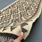 Handmade flatweave Kilim runner rug in hands – neutral beige tones