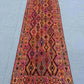 2.9x9.3 Turkish kilim runner rug laid on wooden hallway floor