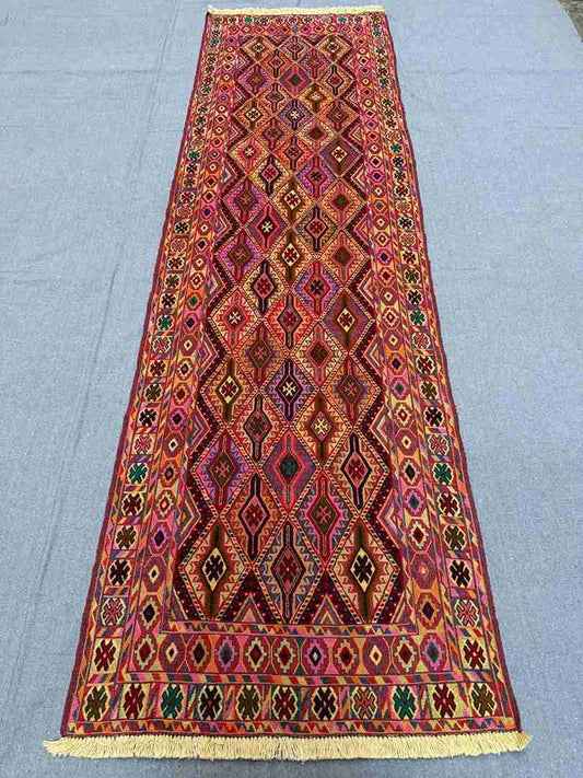 2.9x9.3 Turkish kilim runner rug laid on wooden hallway floor