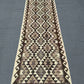 Flatweave Kilim runner on rustic hallway floor – boho décor