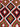 Close-up of tribal wool weave on handmade red and green Kilim runner