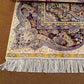 Corner detail of 5x8 knotted Persian-style handmade silk rug