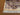 Corner detail of 5x8 knotted Persian-style handmade silk rug