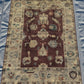Flatlay view of large 5x7 Oushak wool area rug with vintage styling