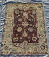 Flatlay view of large 5x7 Oushak wool area rug with vintage styling