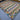 Large flatweave wool rug with geometric pattern on wooden floor