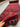Extra-long red Turkish runner rug held in hand displaying Persian-style weave