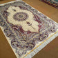 Wide floor view of hand-knotted silk Persian-style carpet