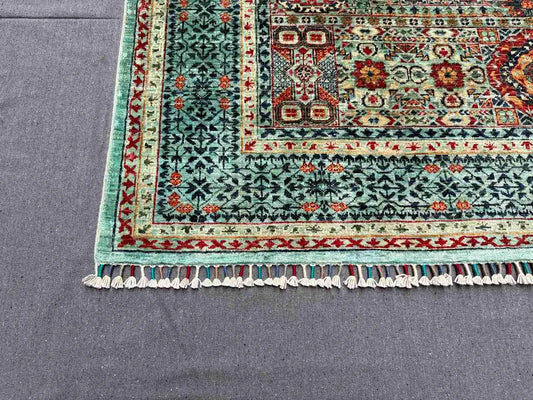 Close-up showing texture of handmade 5x7 Oriental wool rug