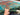 Close view of hand-knotted Mamluk rug in turquoise and orange, shown in hand