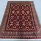 Luxury Persian-style Afghan rug floor placement for home interior