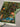 Detailed look at folded Persian silk wall hanging – fine weave and color.
