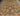 Hand-knotted wool and silk Heriz area rug spread across large room floor