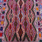 Detailed multicolor tribal pattern on handwoven Turkish kilim wool carpet