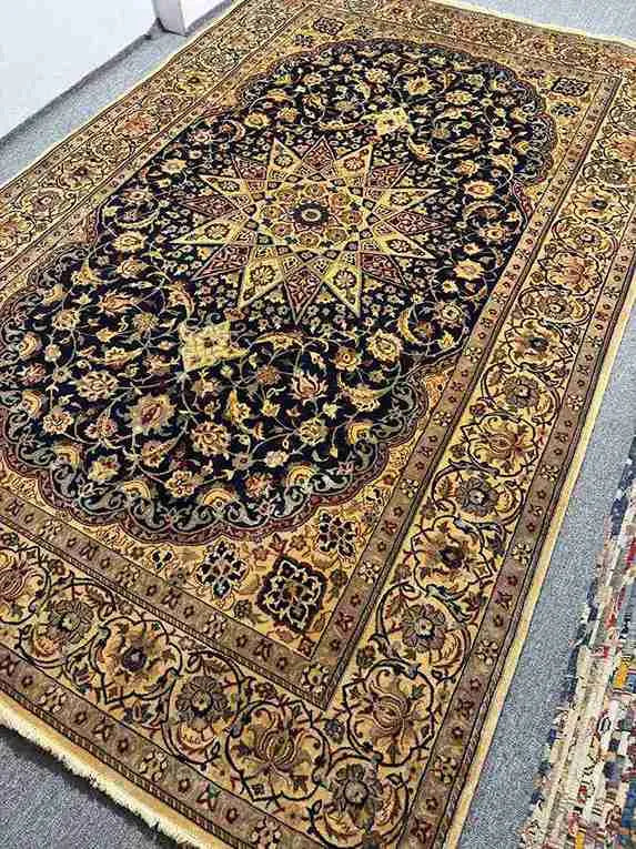 Persian Nain rug under bed – traditional bedroom decor