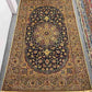 Full view of Persian Nain rug on floor with floral medallion
