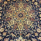 Close-up of Persian Nain rug floral medallion design in wool