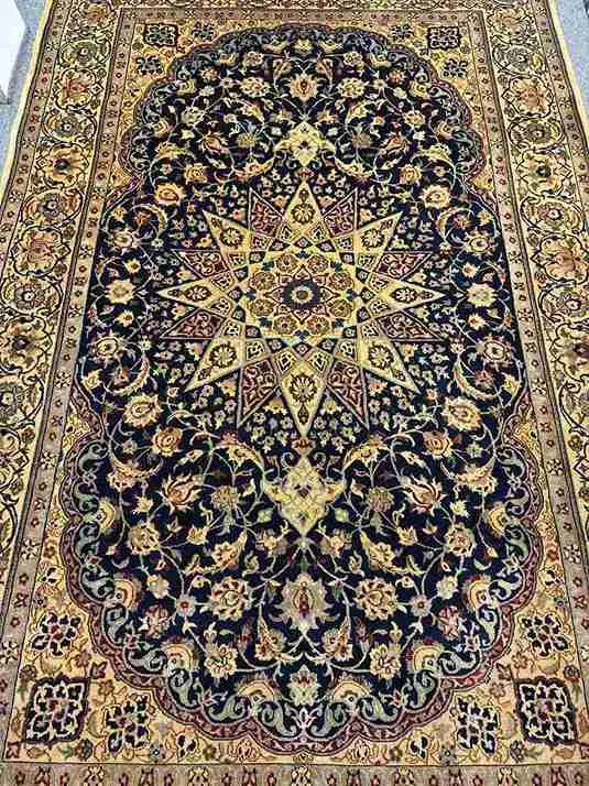 Wool texture and weaving detail of Persian Nain area rug