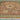 Handmade Persian-style Heriz rug with soft tones styled in spacious living space