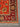 Corner detailing of handmade Orange Chobi rug – intricate knotted weave