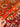 Handmade Orange Chobi Rug shown in hands – premium Turkish wool carpet