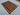 Red and yellow hand-knotted wool rug fully spread on floor