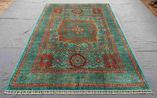 Persian-style Mamluk carpet on living room floor with traditional decor