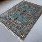 5x7 Persian style Sultani rug in modern living room