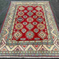 Oriental carpet in red & beige styled on floor for home décor