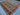 Side angle of luxury geometric Persian-style rug on floor