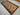 4.4x8.1 Afghan Baluchi runner rug styled on the floor with bohemian accents
